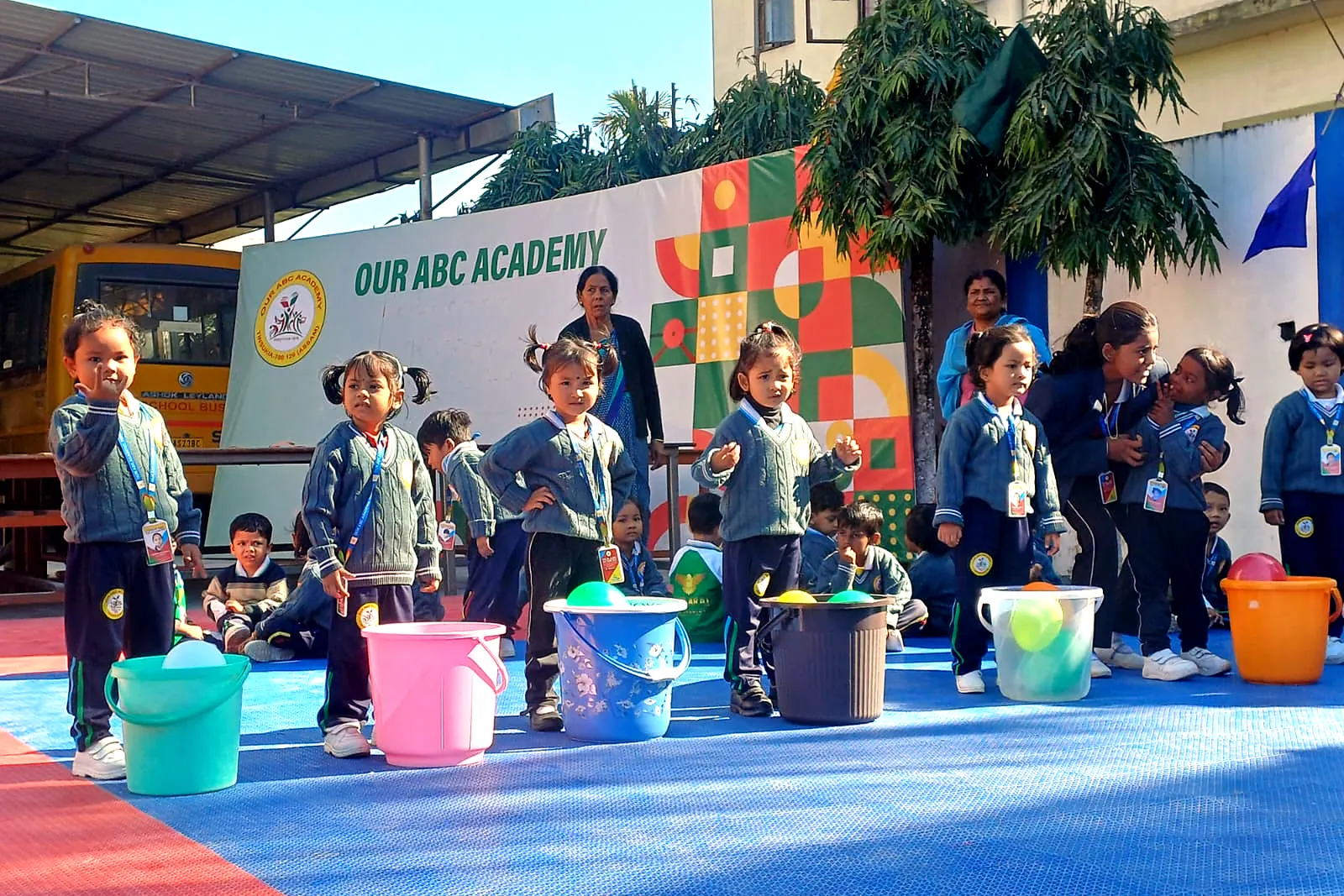 Ball-and-bucket race on the school court