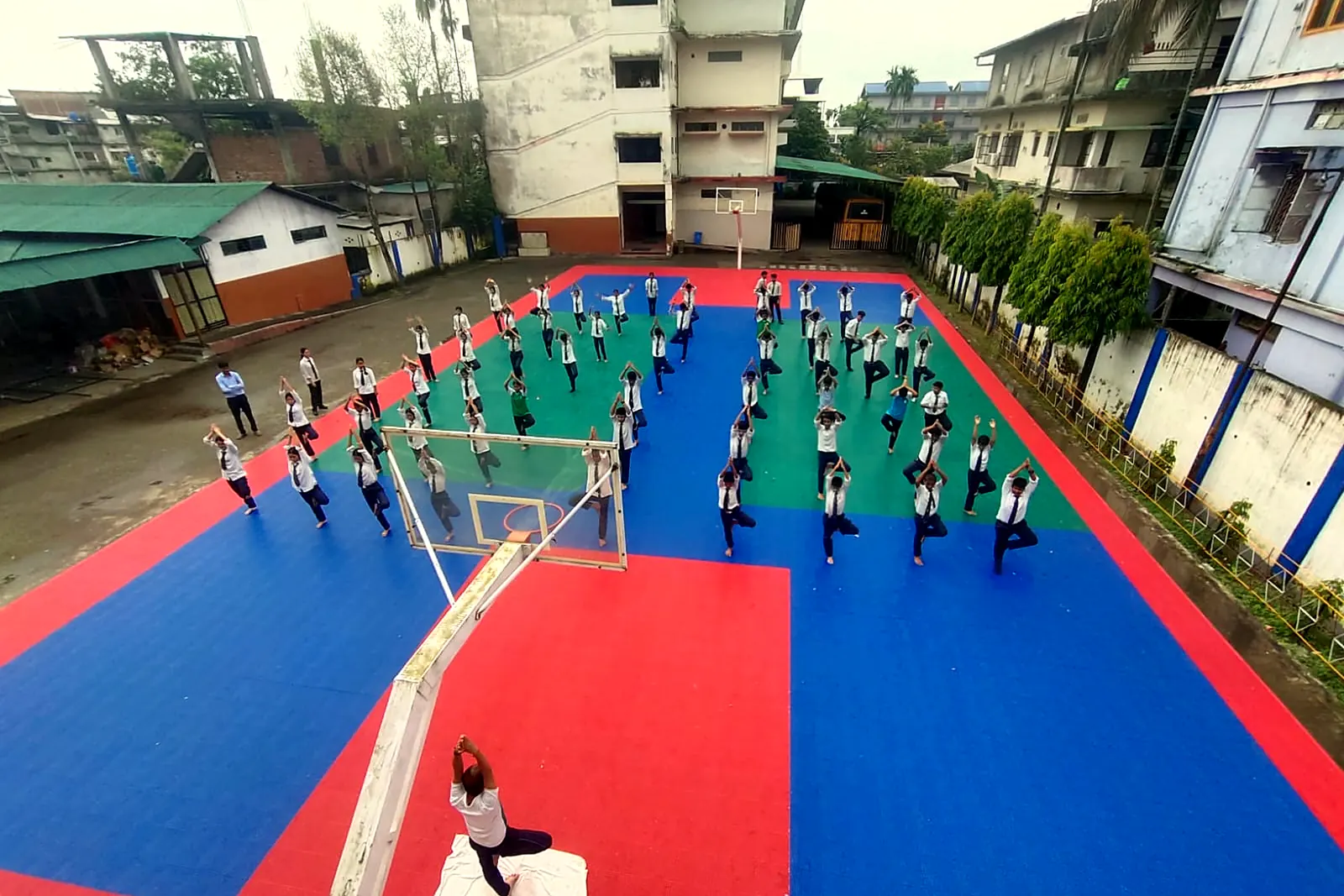 Yoga for the whole school on the court, June 2026